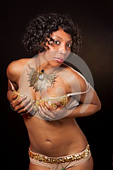 Burlesque dancer cupping her bra