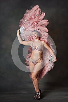Burlesque dancer with feather fans