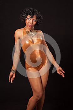 Burlesque dancer in gold leotard