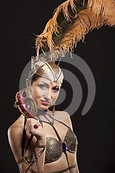 Burlesque dancer in white dress with golden