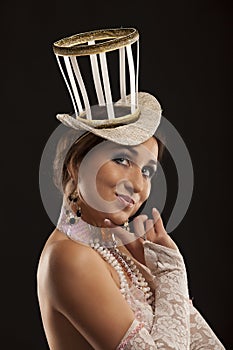 Burlesque dancer in white dress with hat