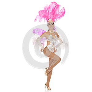 Burlesque dancer in white dress with pink plumage