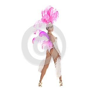 Burlesque dancer in white dress with pink plumage