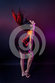 Burlesque performer in black and red corset