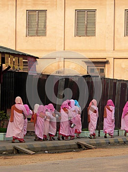 Burma. Nuns Alms Collecting