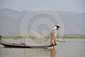 Burma style fishman fishing canoe boat