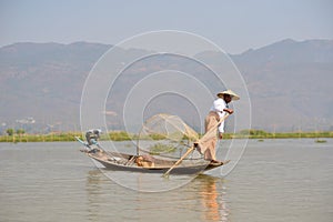 Burma style fishman fishing canoe boat