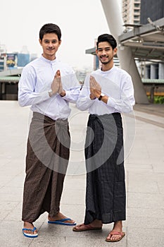 Burmese business men welcome hand sign