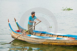 Burmese fishermen in small fishing boats near U-Bein Bridge, in Taungthaman Lake, Amarapura, Myanmar