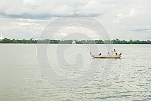 Burmese fishermen in small fishing boats near U-Bein Bridge, in Taungthaman Lake, Amarapura, Myanmar