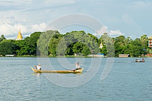 Burmese fishermen in small fishing boats near U-Bein Bridge, in Taungthaman Lake, Amarapura, Myanmar