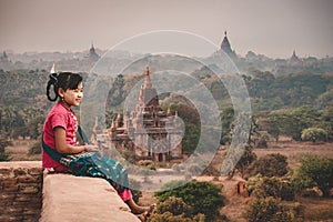 Burmese girls Sitting on a pagoda