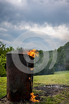 Burn barrel in a rural area used to incinerate trash and garbage. photo