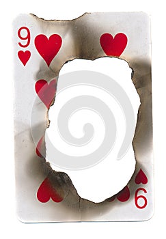Burn hole in old dirty playing card of hearts