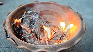 Burn joss paper gold and silver paper as sacrificial offering for pray to god