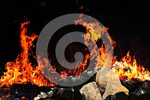 Burn a lot of waste plastic garbage, Garbage bin pile Dump Lots of junk Polluting with Plastic Burning heap of smoke