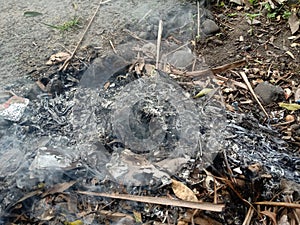 burn trash on the side of the road