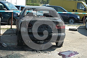 Burned car on accident site