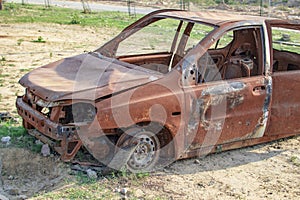 Burned car with all windows and no glass