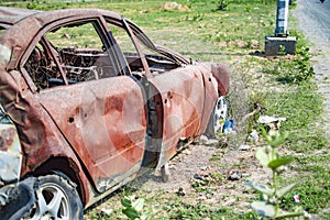 Burned car with burnt plastic and rubber