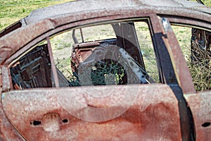Burned car with burnt seats and doors