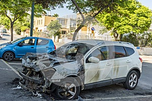 Burned car close up. Car after the fire, crime of vandalism, riots. Arson car. Accident on the road due to speeding