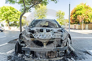Burned car close up. Car after the fire, crime of vandalism, riots. Arson car. Accident on the road due to speeding