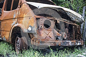 Burned car. Consequences of car accident. Damaged by arson. Machine after a fire