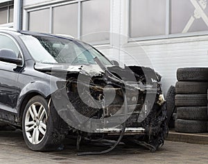 Burned car after a fire, greatly damaged car in  insurance concept