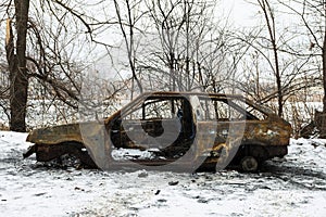 Burned car after a fire happened in winter park.