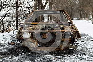 Burned car after a fire happened in winter park.