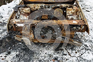 Burned car after a fire happened in winter park.