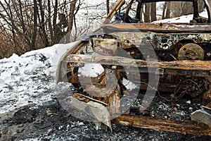 Burned car after a fire happened in winter park.