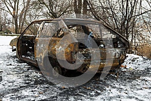 Burned car after a fire happened in winter park.