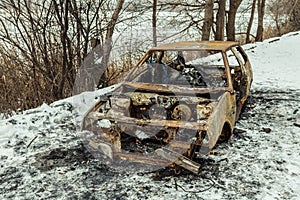 Burned car after a fire happened in winter park.