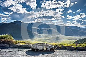 Burned car on the road