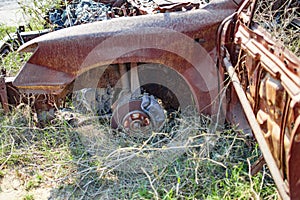 Burned car with rust and damaged body