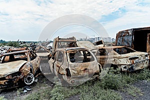 Burned civilian car. Stacked vehicles. War in Ukraine, Bucha