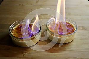 Burned cream dessert with fire photo