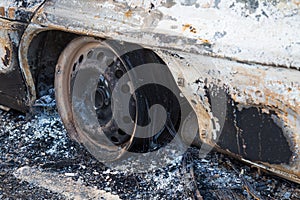 Burned down car, abstract background, selective focus. The situation of protests in the world