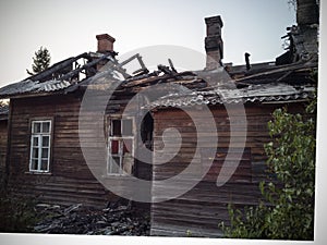 burned-down wooden house