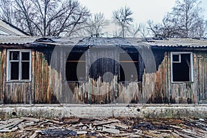 Burned by fire abandoned wooden house