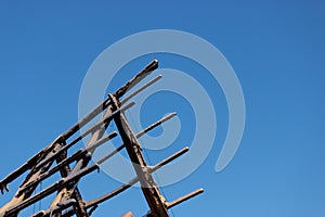 Burned house against blue sky