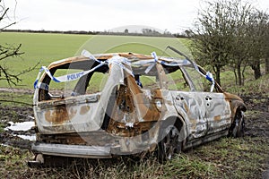 Burned out car on the roadside England UK