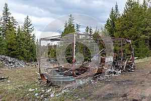 The burned out frame of a motorhome damaged by fire