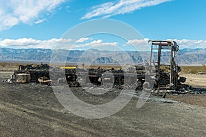 A burned out motor home in the desert