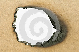 Burned paper and hole