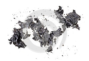 Burned paper on white background, top view