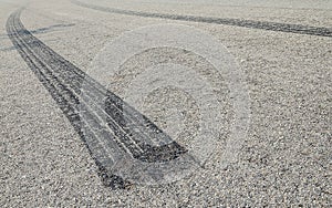 Burned rubber tire track on an asphalt road