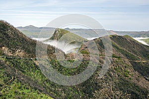 Burned shrubs,cloudiness in the valley, Paul da serra high plain